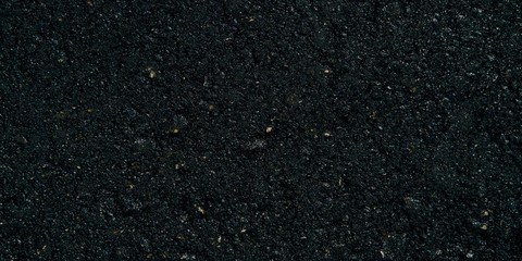 The texture of the black grunge asphalt Banner photo. The seamless texture of bitumen road asphalt.