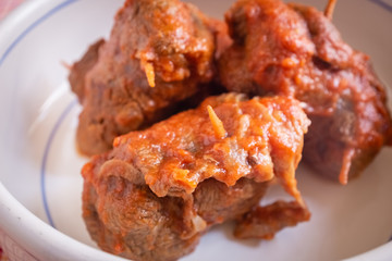 Delicious dish made of beef meat roll called braciola with tomato sauce. Apulia typical food. Italy