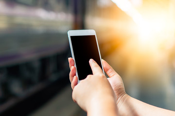 Young smart solo woman tourist travel use mobile phone application plan search information organize trip book reserve transportation bus train hotel flight by internet cashless credit card technology