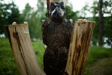 Beautiful wooden Raven totem in Russia. Slavic totem.