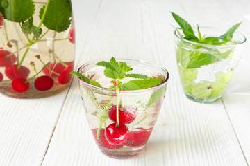 Fresh cool drink of ripe juicy cherry and gooseberry berries