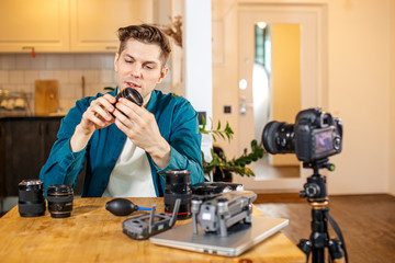 blogging as a habby. blogger and photographer in one face showing different DSLR on camera, unpack and talk about pros, cons, how to use and which is appropriate
