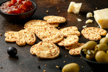 Cheese Palmiers with garlic, parmesan, grape, olives and chutney. party food snacks