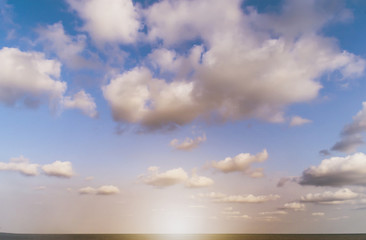 blue sky background with tiny clouds