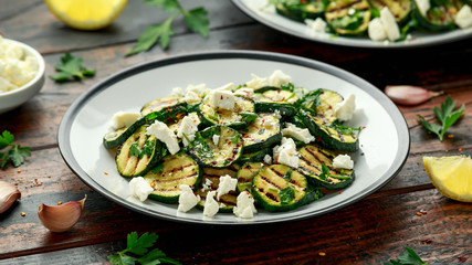 Warm salad with grilled zucchini, garlic and herbs