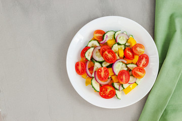 Green salad with tomato and fresh vegetables