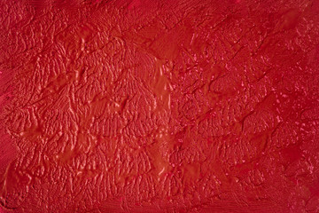 A beautiful Crimson paint texture on wall, background - Image. Color paint strokes.