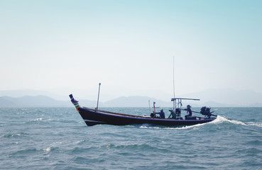 boat in the sea in the evening sunlight over beautiful sky background, luxury summer adventure, active vacation in Thailand