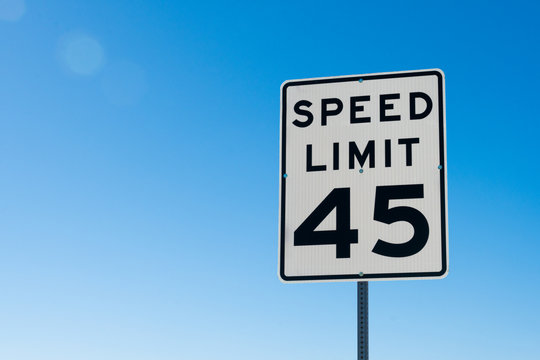 speed limit sign on blue sky
