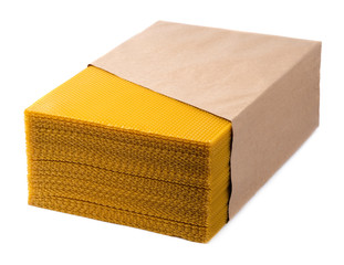 Beeswax. Wax base for honey bee rebuilding on a white background. Honeycombs.