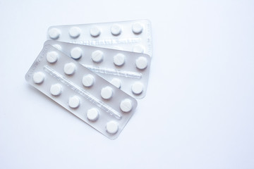 Medical medicines in plastic packaging on a white background