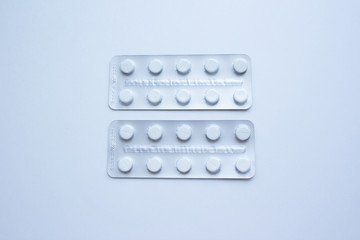 Medical pills in plastic packaging on a white background