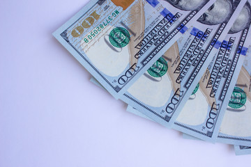 One hundred dollar bills on white background