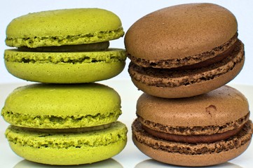 pistachio and chocolate flavor macarooon on white background