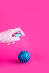 Content is associated with the virus, an antiseptic for the hands. Coronavirus, a place for text on a pink background.