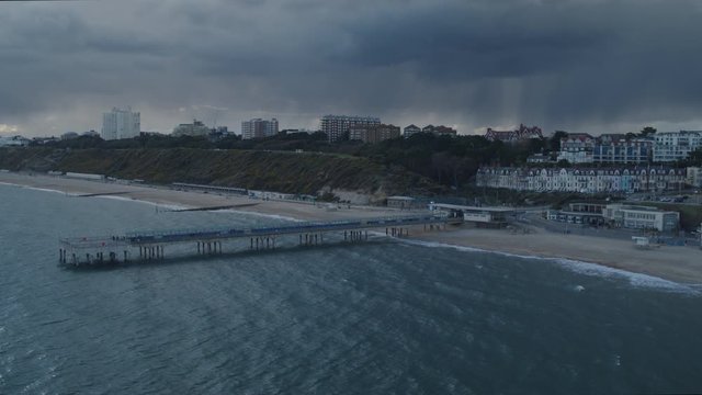 Aerial shot of Boscombe Pier, with Boscombe and Bournemouth in the background as a large storm passes.