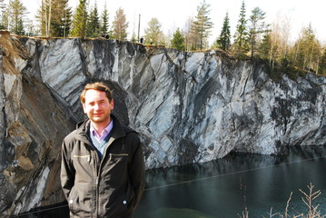 Man in Mountain park Ruskeala is tourist complex located in Sortavala region of Republic of Karelia...