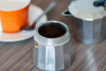 Traditional coffee maker with ground coffee