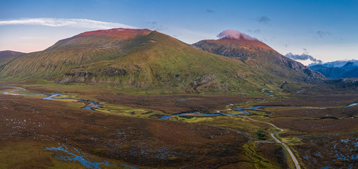 Aerial Panoramic View of Beinn Spionnaidh and Cranstackie at Sunset in Scotland