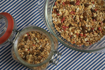 Granola, homemade muesli in a jar and on a plate. Vertical and horizontal photos