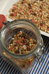 Granola, homemade muesli in a jar and on a plate. Vertical and horizontal photos
