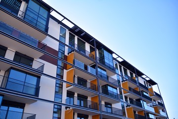 Contemporary residential building exterior in the daylight. Modern apartment buildings on a sunny...