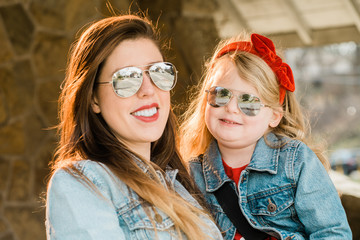Mother and daughter with mirror sunglasses