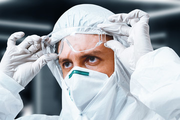 Concentrated scientist in protective suit