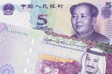 A close up image of a five riyal note from Saudi Arabia along with a five yuan bank note from the People's Republic of China