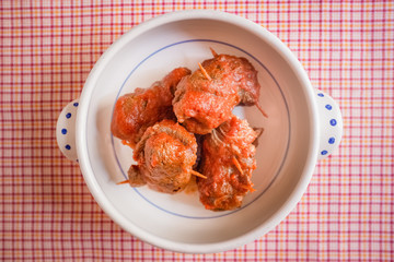 Delicious dish made of beef meat roll called braciola with tomato sauce. Apulia typical food. Italy