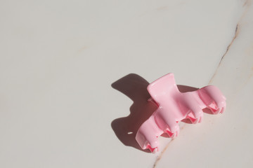  Women's fashion accessories pastel-colored hair clips on white marble. Top view fashion, beauty.fashion blogger concept