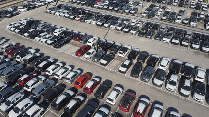 Obraz premium LOGISTIC AND TRADE AUTOMOBILE CENTER. DRONE AERIAL PHOTO. VEHICLE PARK