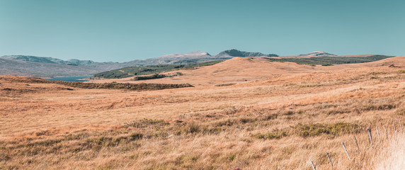 Mountain Range Against Blue Sky in Scotland