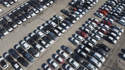 LOGISTIC AND TRADE AUTOMOBILE CENTER. DRONE AERIAL PHOTO. VEHICLE PARK