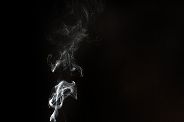 White smoke on a black background. Copy space