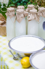 Fresh milk in recyclable glass bottles are on the market counter