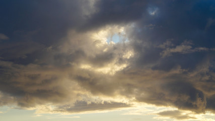 Naklejka na ściany i meble clouds over the sea at sunset.