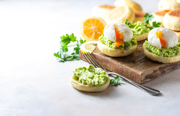 Fresh Homemade English Muffins with Avocado and Egg. Breakfast, morning concept.