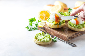 Fresh Homemade English Muffins with Avocado and Egg. Breakfast, morning concept.