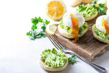 Fresh Homemade English Muffins with Avocado and Egg. Breakfast, morning concept.