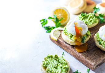 Fresh Homemade English Muffins with Avocado and Egg. Breakfast, morning concept.