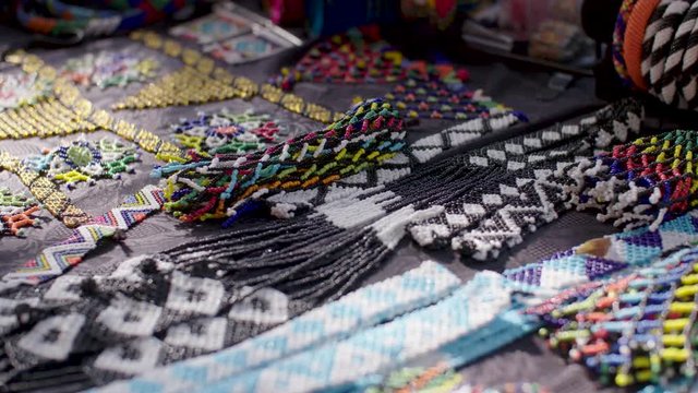 A close up shot of the colourful, handmade beaded jewellery for sale at a crafts market in the Maboneng district of Johannesburg, South Africa.
