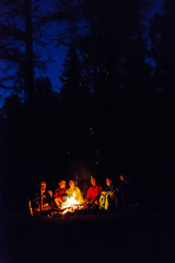 group of tourists are resting by the fire