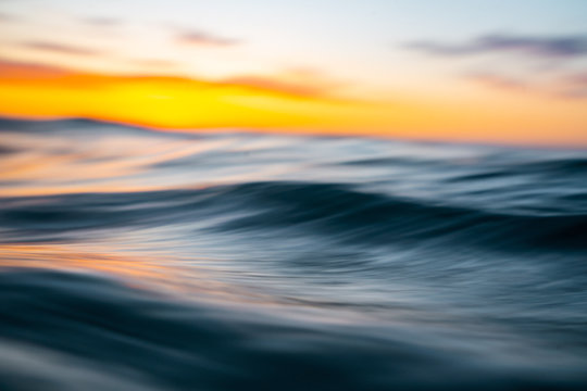View of waves in sea during sunset