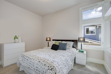 Fototapeta na wymiar Boy's room with black and white alphabet bedding. Luxury American modern home.