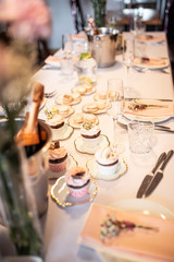 Beautiful table set for an event party or wedding reception . restaurant interior cakes on table