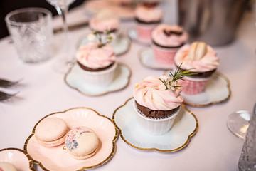 Beautiful table set for an event party or wedding reception . restaurant interior cakes on table