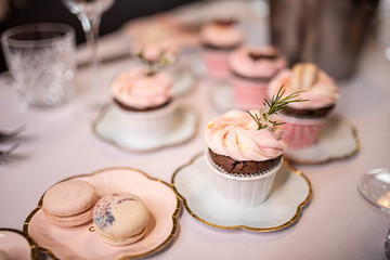 Beautiful table set for an event party or wedding reception . restaurant interior cakes on table