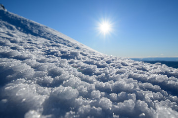 Texture of natural snow. View above the snow.