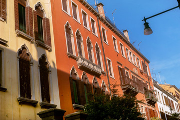 Fototapeta na wymiar Windows And Shutters wiht flovers.Venice Italy